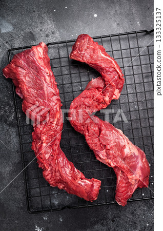 Raw Beef Steak Machete, uncooked meat . black background. top view Raw Beef Steak Machete, uncooked meat . black background. top view 133325137
