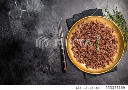 Roast and Fried mince meat, fresh cooked ground meat in a plate. black background. top view Roast and Fried mince meat, fresh cooked ground meat in a plate. black background. top view 133325169