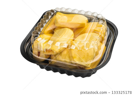 Ripe, golden yellow jackfruit pods (bulbs) served in a black plastic container, ready-to-eat, against a clean white background. Exotic tropical fruit. 133325178