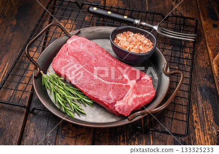 Ready for cooking Raw Rump beef steak with herbs. wooden background. top view Ready for cooking Raw Rump beef steak with herbs. wooden background. top view 133325233