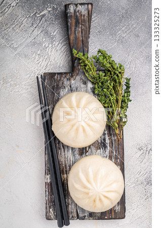 Traditional Dumpling Momos with meat on wooden board. white background. top view 133325273