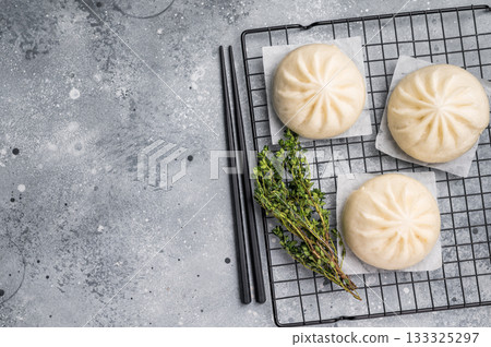 Baozi Bun, Chinese Steamed bun with meat. grey background. top view 133325297