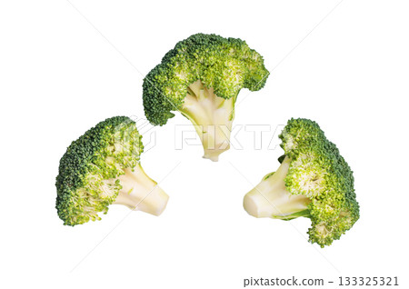 Fresh raw broccoli pieces isolated on white background. top view Fresh raw broccoli pieces isolated on white background. top view 133325321