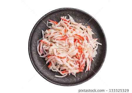 Crab meat, crabmeat imitation on a plate isolated on the white background. top view 133325329