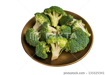 Fresh broccoli cabbage pieces on a plate isolated on white background. top view Fresh broccoli cabbage pieces on a plate isolated on white background. top view 133325341