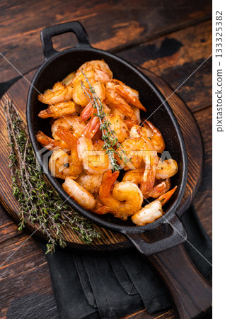 Deliciously seasoned grilled shrimp prawns with vibrant colors, a must-have for seafood lovers and culinary enthusiasts. wooden background. top view Deliciously seasoned grilled shrimp prawns with vibrant colors, a must-have for seafood lovers and culinary enthusiasts. wooden background. top view 133325382