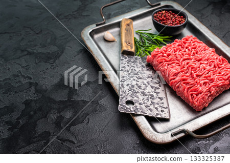 Uncooked Raw beef mince meat, forcemeat, in kitchen tray ready for cooking. 133325387