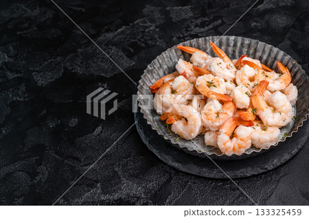 A plate of shrimp. The shrimp are arranged in a circular pattern, with some of them overlapping each other. The dish looks appetizing and inviting. A plate of shrimp. The shrimp are arranged in a circular pattern, with some of them overlapping each other. The dish looks appetizing and inviting. 133325459