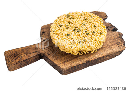 Twisted raw ramen noodles, ready to soak up flavors and bring warmth to your next culinary adventure. isolated on white background. top view 133325486