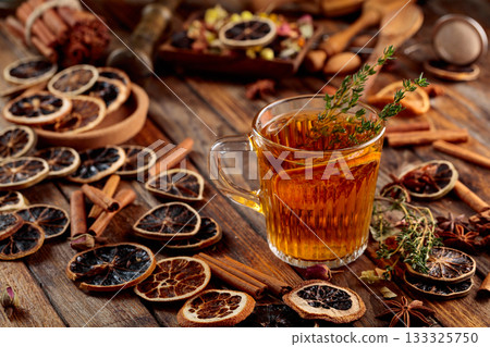 Herbal tea with thyme and dried citrus. 133325750