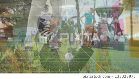 Kneeling man placing golf ball on tee on sunlit fairway, with golf cart and financial charts Kneeling man placing golf ball on tee on sunlit fairway, with golf cart and financial charts 133325975