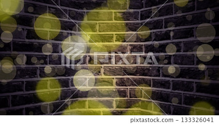 Showing exposed brick wall corner in studio space, with translucent yellow and white light overlays 133326041