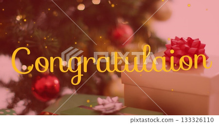 Stack of gift boxes sitting on table in festive room, with Christmas tree, confetti, copy space 133326110