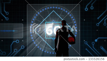 Basketball player silhouette in jersey holding basketball in studio with digital display showing 60 Basketball player silhouette in jersey holding basketball in studio with digital display showing 60 133326156