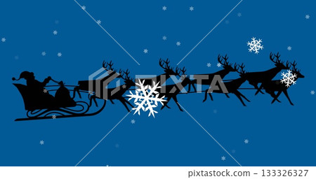 Riding Santa silhouette in sleigh with gift sack being pulled by eight reindeer across blue sky 133326327