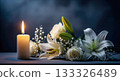 Condolence background with burning candle and white flowers, funeral concept with lily and rose for sympathy card, in loving memory and sad sorrow. 133326489