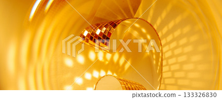 Abstract sparkling golden panoramic banner background with spirals and reflections. Designed for holiday sales Christmas and New Year campaigns. 133326830
