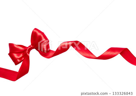 Long red satin ribbon with decorative bow and curled ends, isolated on white background. Perfect for wrapping gifts, banners and festive projects. 133326843
