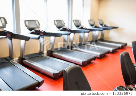 Treadmills arranged in gym 133326973