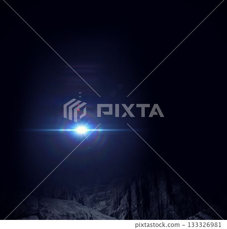 Bright blue-white light source is illuminating rugged rocky canyon at night in 3D render Bright blue-white light source is illuminating rugged rocky canyon at night in 3D render 133326981