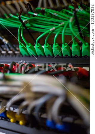 Flat design is illustrating patch panels with green and red Ethernet cables, blurred cables 133327038