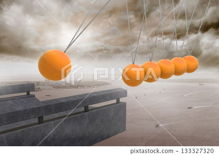 Newtons cradle above coastline 133327320