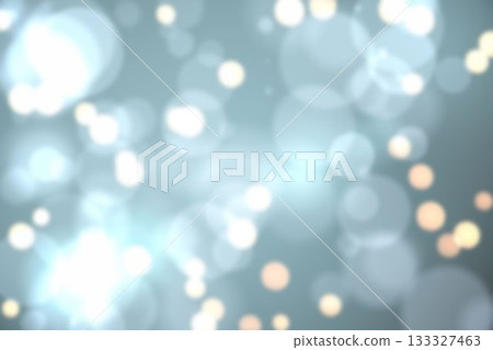 Abstract bokeh pattern is glowing with overlapping translucent orbs over muted bluish gray backdrop 133327463