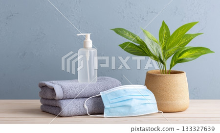 Sanitizer, towel, mask, and plant arrangement for cleanliness and health 133327639
