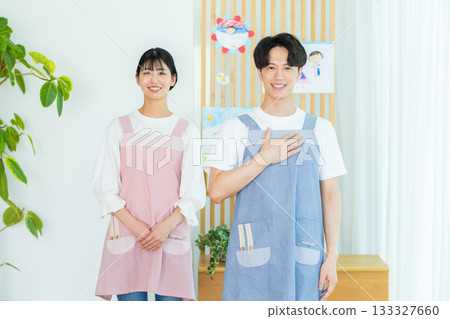 Nursery teacher wearing an apron 133327660