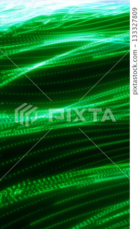 A green glowing abstract texture with deep, glowing lines that flow and create a digital, almost liquid effect 133327809