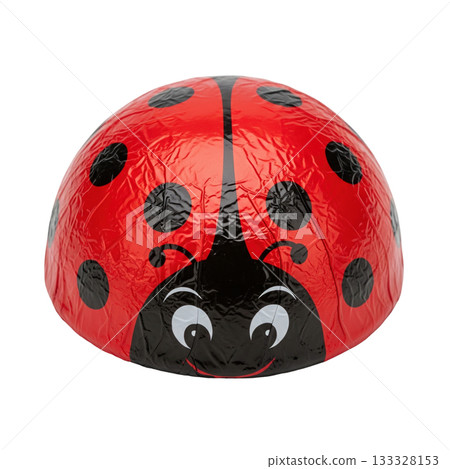 Red ladybug chocolate candy wrapped in foil with black spots for sweet spring holiday treat 133328153