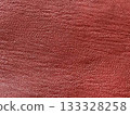 Red synthetic leather cloth 133328258