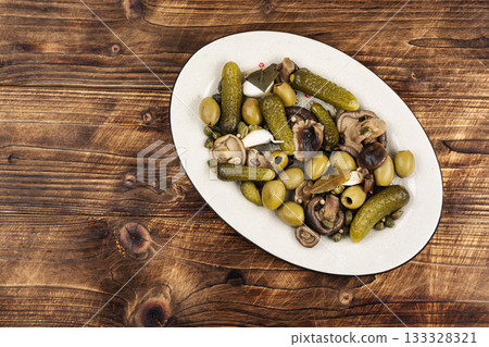 salted cucumbers, marinated mushrooms and olives 133328321