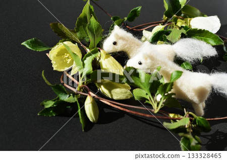 Wool felt white horse and winter-flowering clematis 133328465