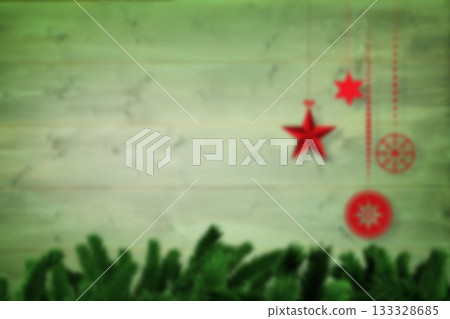 Blurred christmas decorations hanging over wood Blurred christmas decorations hanging over wood 133328685