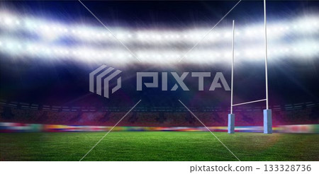 White rugby goal posts standing right side on floodlit green pitch, tiered seating, rain falling White rugby goal posts standing right side on floodlit green pitch, tiered seating, rain falling 133328736
