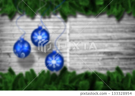 Christmas baubles hanging over wood 133328954