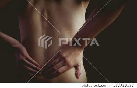 Woman's back is being shown in flat design with hand placement highlighting spine contours 133329153