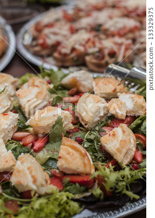 Wedding catering showing goat cheese salad and bruschetta appetizers 133329375