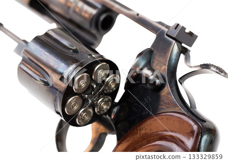 Closeup of revolver with open fully loaded cylinder 133329859