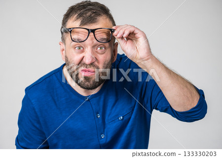 Surprised man wearing eyeglasses 133330203