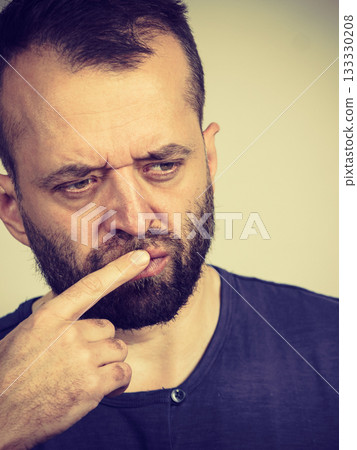 Confused focused serious man thinking Confused focused serious man thinking 133330208