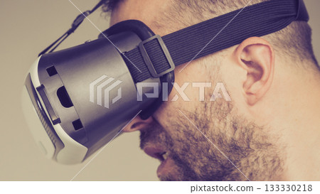 Adult man wearing vr goggles Adult man wearing vr goggles 133330218