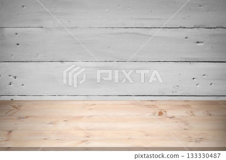Light brown wooden tabletop is being shown in flat design, with whitewashed plank wall backdrop 133330487