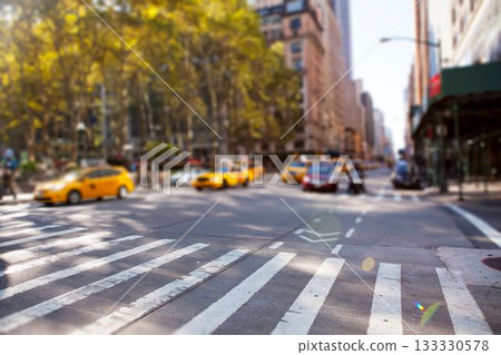 Flat design is showing yellow taxis waiting at busy crosswalk beside leafy trees with scaffolding Flat design is showing yellow taxis waiting at busy crosswalk beside leafy trees with scaffolding 133330578