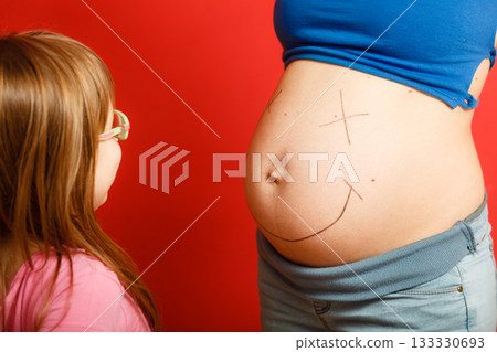 pregnant woman with her daughter pregnant woman with her daughter 133330693