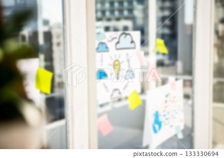 Charts on glass window in office 133330694