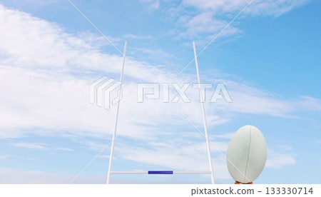 Rugby ball in front of posts 133330714
