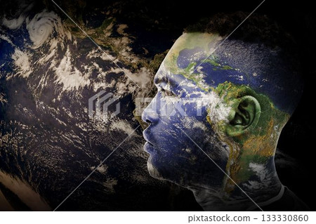 Profile of male head in digital composite over space void merging Earth textures, showing hurricane Profile of male head in digital composite over space void merging Earth textures, showing hurricane 133330860