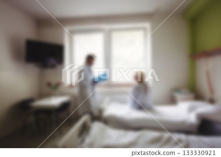 Doctor talking to patient in hospital room Doctor talking to patient in hospital room 133330921